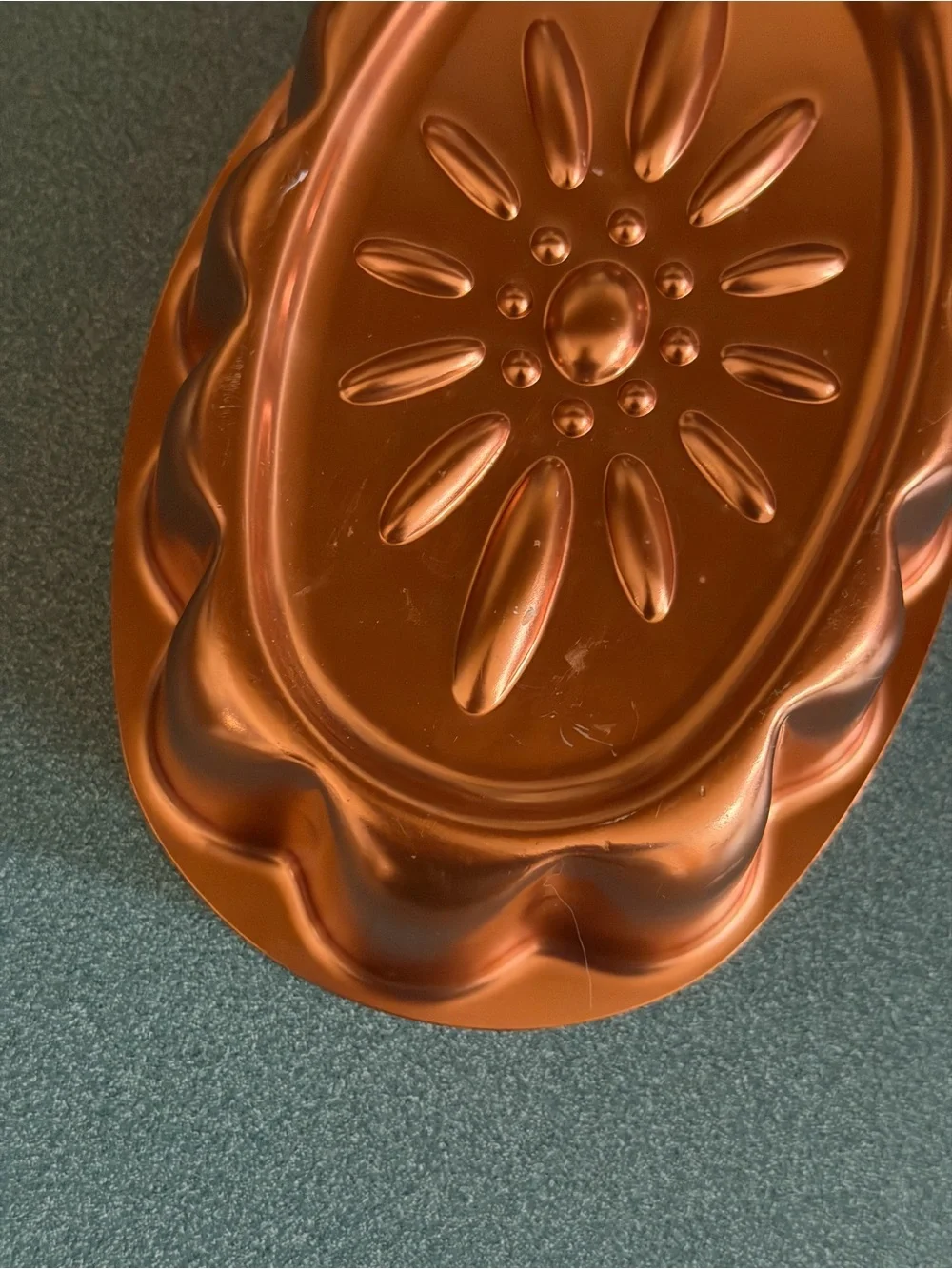 Vintage copper-colored aluminum daisy pattern mold